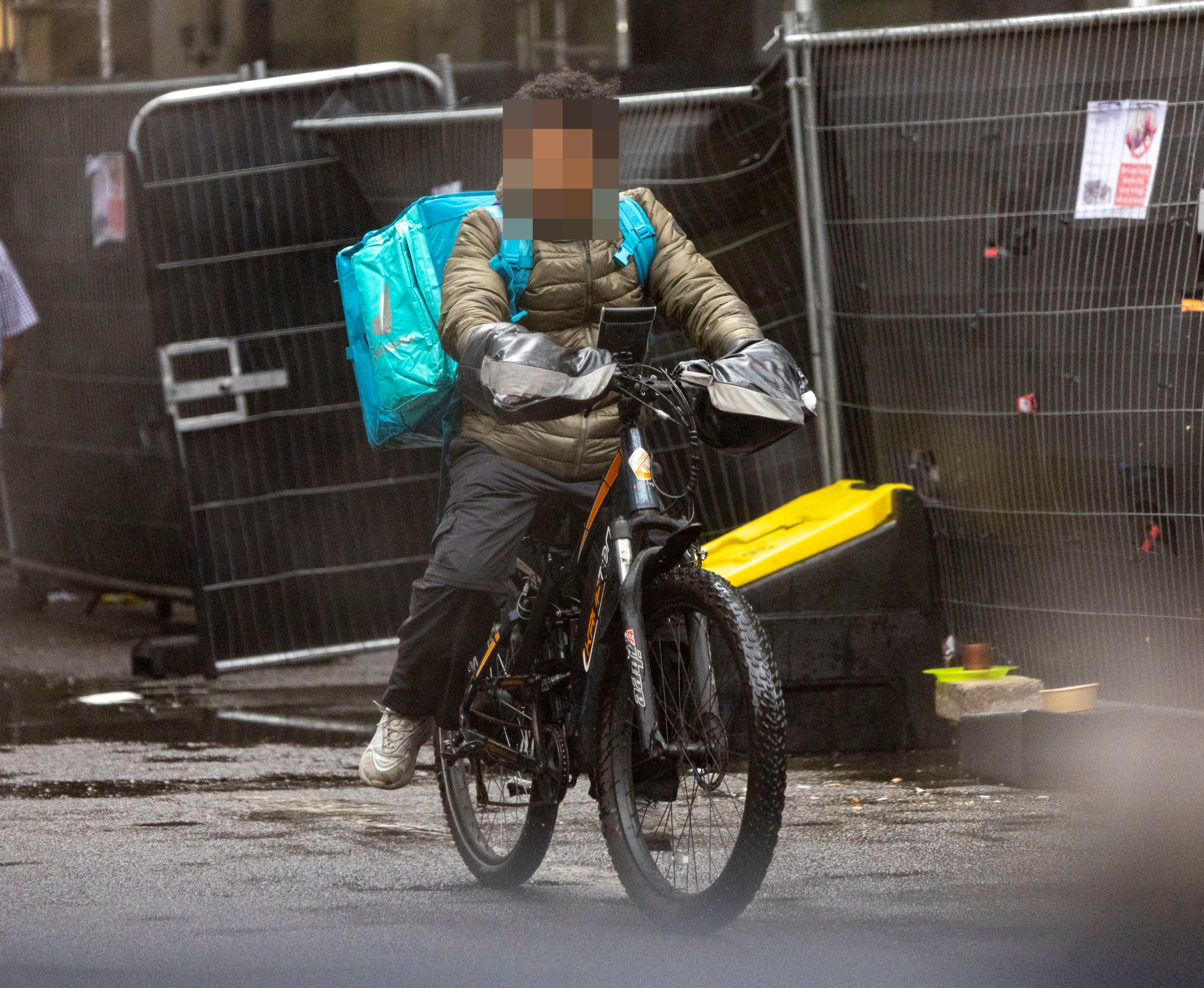 Multiple delivery riders with censored faces showing illegal operations